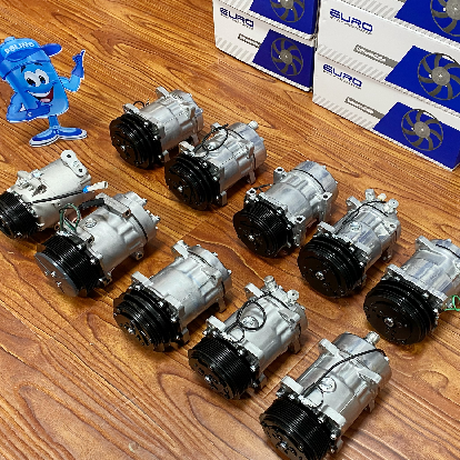 AC compressors neatly arranged on table