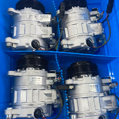 Neatly arranged heavy-duty AC compressors for quality inspection