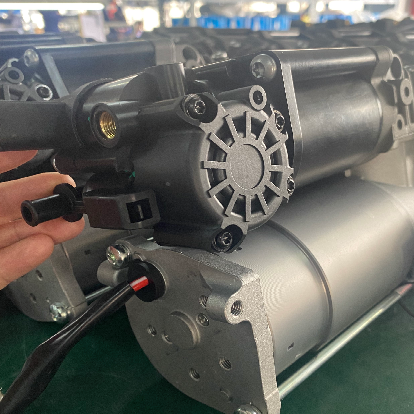 Close-up of handheld heavy-duty AC compressor