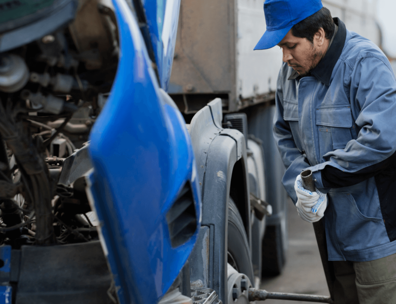 technician inspecting vehicle ignition system for replacement
