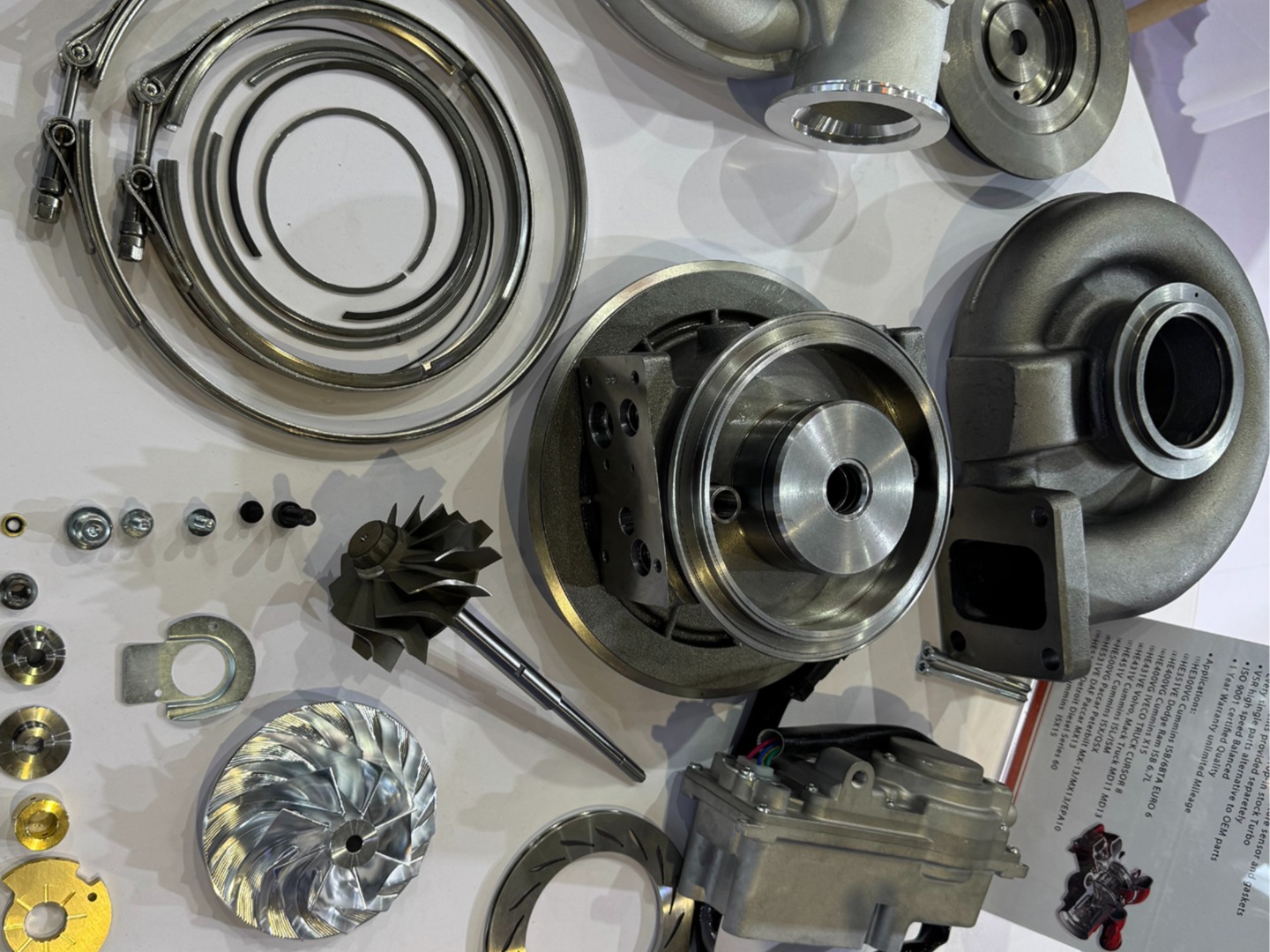 turbocharger assembly with disassembled parts on white cloth