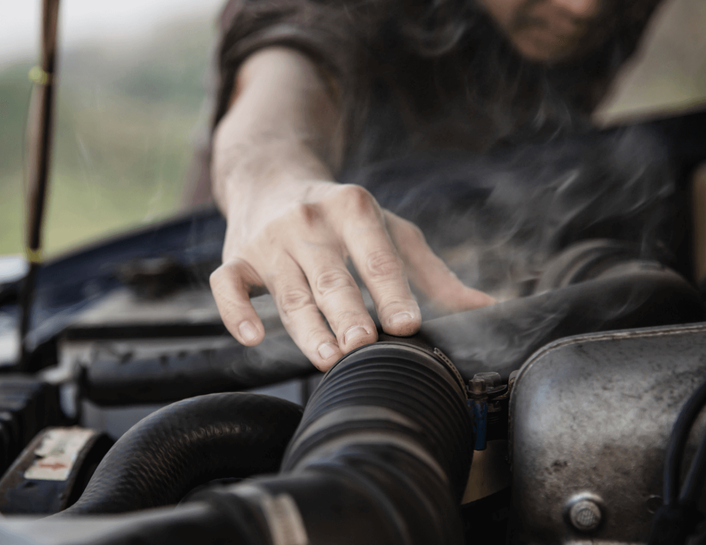 mechanic diagnosing ignition coil failure during engine repair