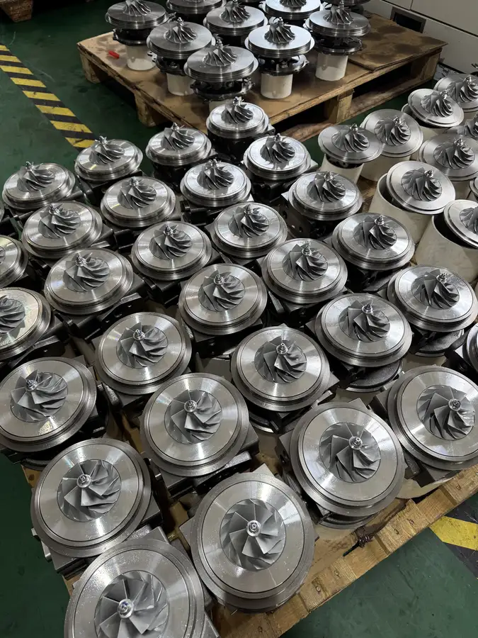 Different turbo center assemblies staged together in a real workshop