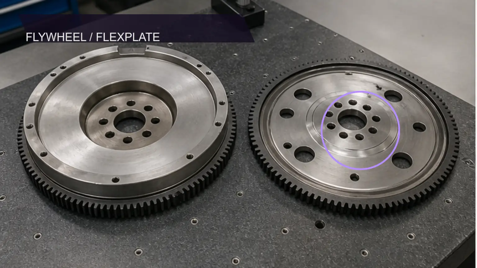 Heavy-duty manual flywheel and automatic flexplate compared on an inspection table
