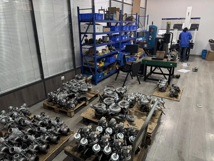 Mixed turbo assemblies, parts shelving and adjacent test workstations in a workshop