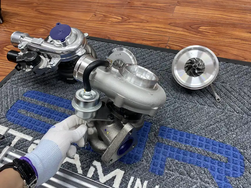 Several complete turbochargers and core assemblies arranged on a work surface
