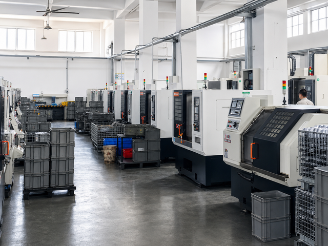 Fan clutch manufacturing area with finished parts and CNC machining equipment