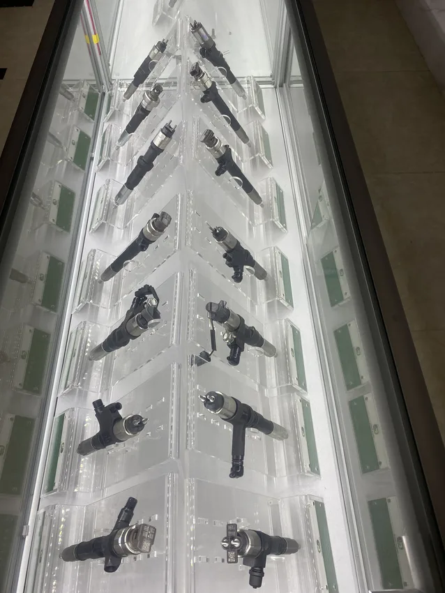 Different injector bodies and connection arrangements displayed in a real showroom