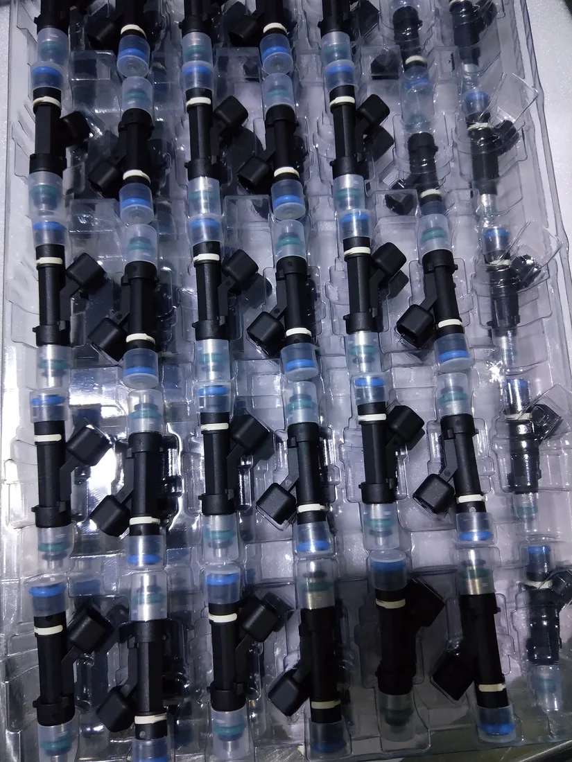 Diesel injectors arranged in individual clear protective trays