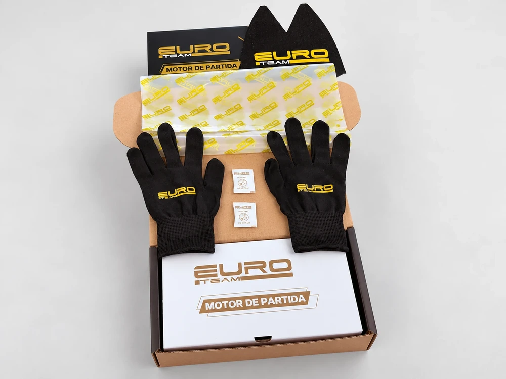 Black and gold packaging with branded protective material and black gloves