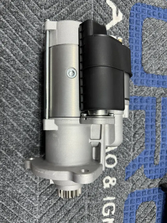 Complete starter motor showing the motor housing, solenoid area, mounting flange and drive pinion