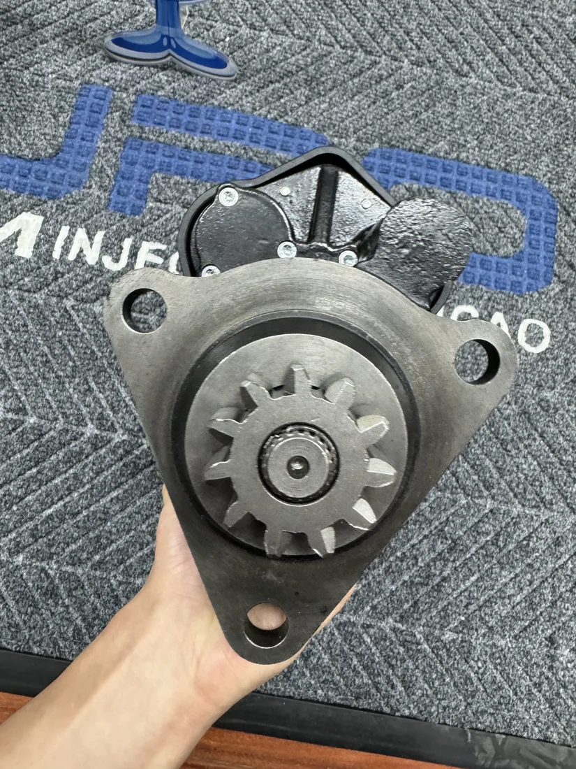 Hand-held starter motor showing the drive end and mounting flange