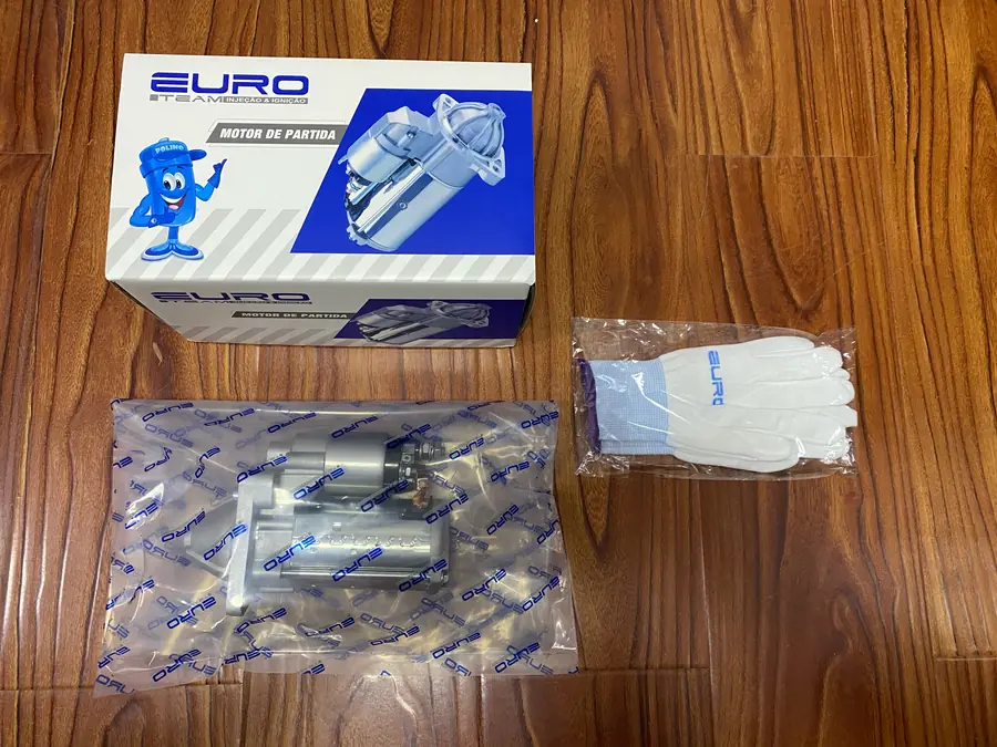 Bagged starter beside a carton; shipment qualification and model compatibility not established.