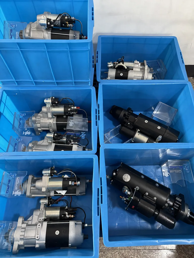 Starter motor assemblies separated in blue storage bins